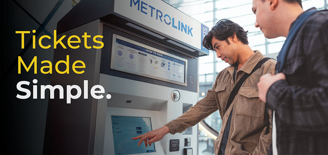 two customers in front ticket machine